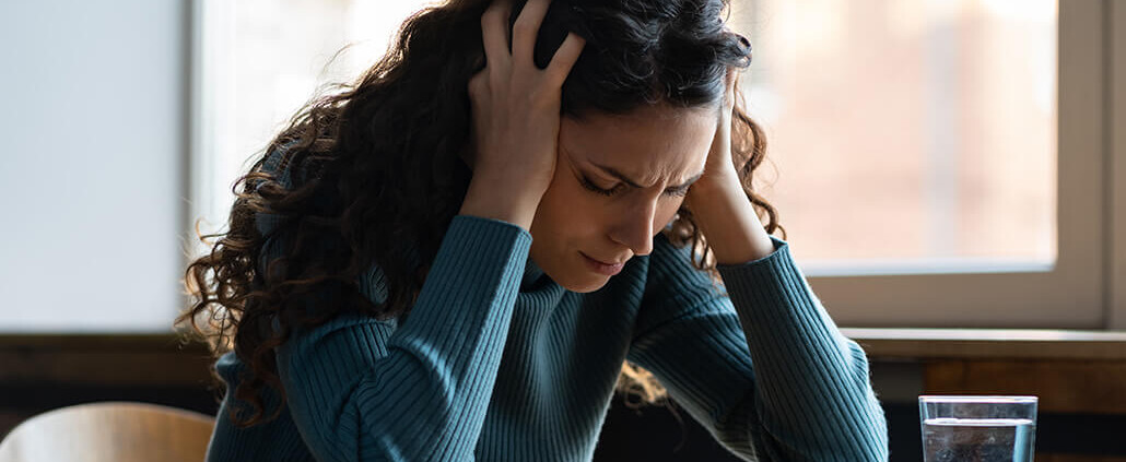 unhappy woman stressed at desk