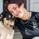 Young compassionate woman with a dog who has been abused.