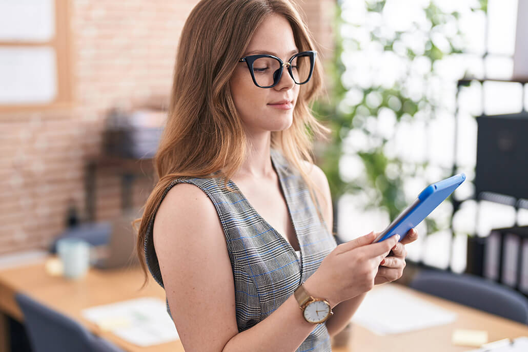 Woman reading information on tablet